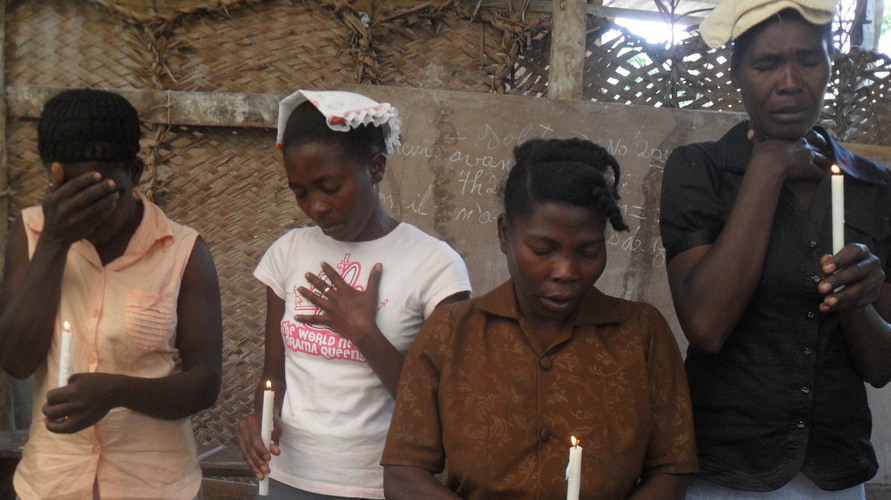 candle light vigil for cholera victims in haaiti